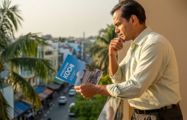 A man looking to best places to buy property in Kochi for nris