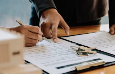 Real estate agent offer hand for customer sign agreement scaled 1